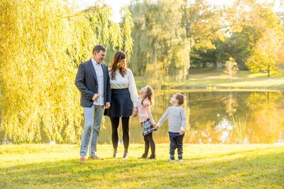 boston engaged couple at the beach hugging in golden hour