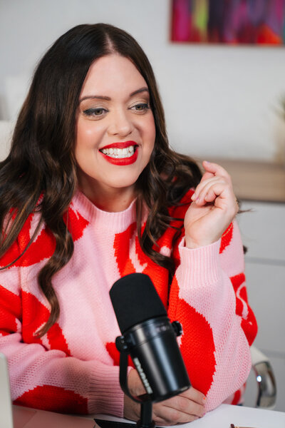 heather smiling with podcast microphone