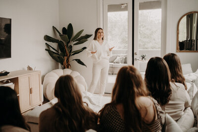 Founder Dana speaking to a room full of women