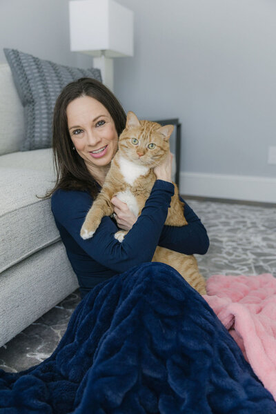 Professional home organizer Kelly George with a rescue cat saved by Houston Pets Alive
