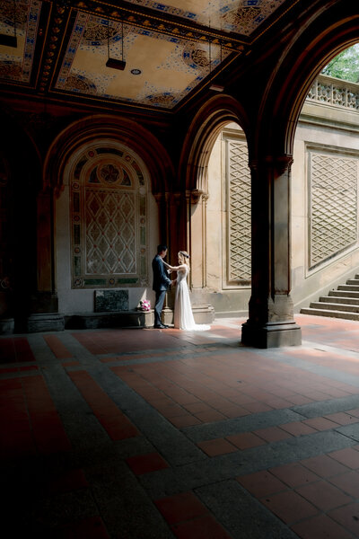 bride-and-groom-reading-their-vows-in-Bethesda-Terrace-in-Central-Park