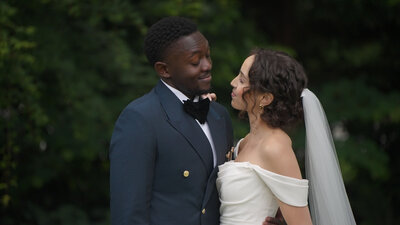 bride and groom smiling at each other