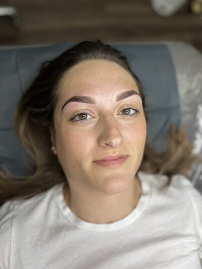 woman with powder eyebrow tattoos.