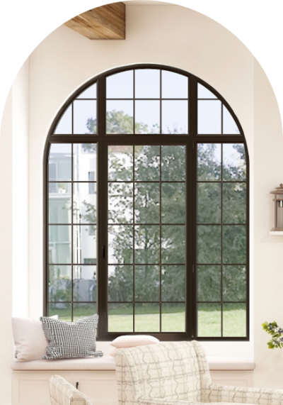 Luxury meditteranian home with a large arched casement window framed by 3 picture windows that capture the view of the large grass area and trees.