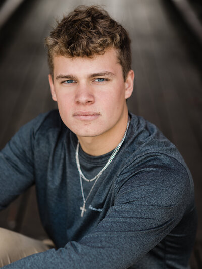 high school senior graduate posed for senior portraits at shooters on the water