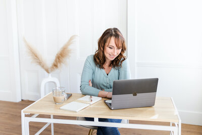 iphone sitting on a notebook and keyboard