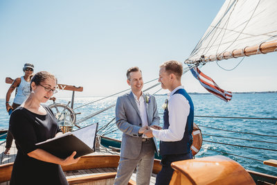 two men get married on a yacht