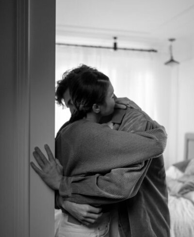 Couple hugging in a room can represent the success a couple in the aftermath of infidelity can feel after healing and rebuilding trust. If you want to be one of our success stories schedule a free consultation today to learn if you can benefit from out affair recovery coaching program by relationship Experts in the USA and Canada.