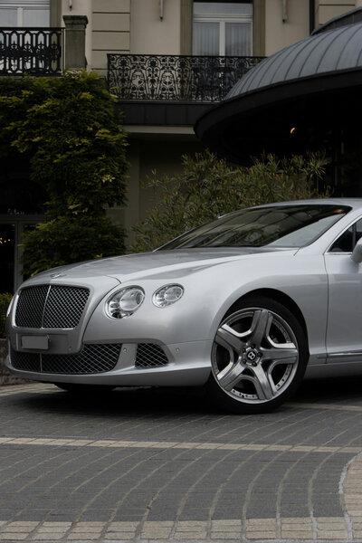 Silver Bentley parked after detailing service