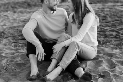 couple sitting in sand