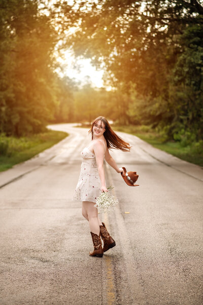 high school senior girl with short blonde hair standing in front of pink stairs and building in winter park, shot by Melissa Vinsik Photography - Orlando Senior Photographer