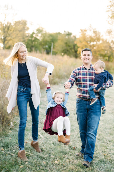 young family walks with children