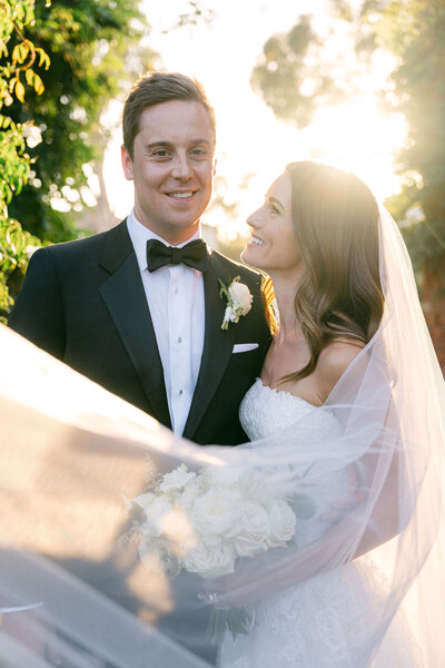 bride and groom portrait taken on the balcony at Vibiana overlooking the city of Los Angeles captured by los angeles wedding photographer magnolia west photography