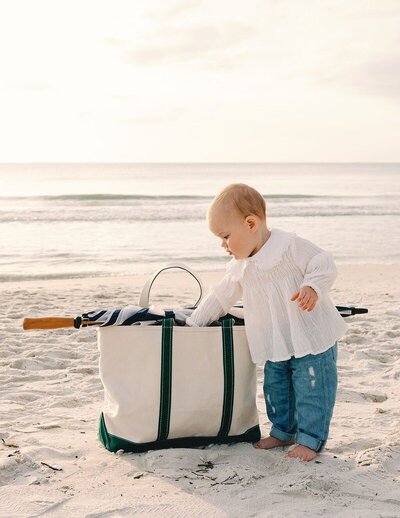 kid reaching inside beach bag taken on naples beach