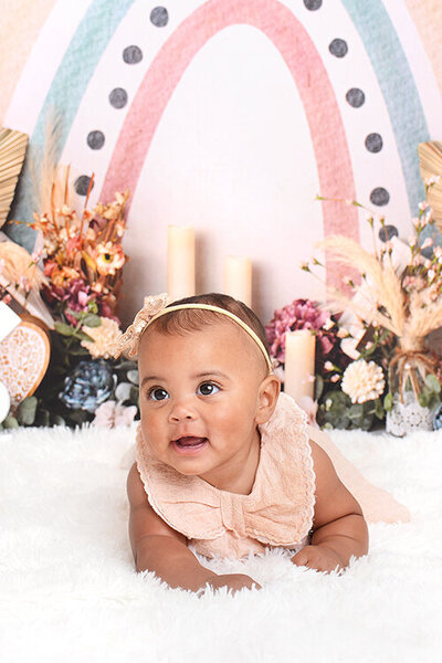 girl smiles at her half birthday photoshoot