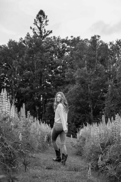 Black and White Photo of Girl walking away in field | Senior Session