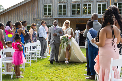Bride and groom walking down the isle 