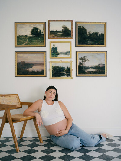 Mother and daughter cuddling on a sofa in a studio in Vancouver