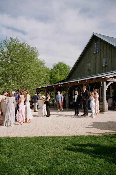 bride and groom walking into reception hall