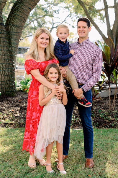 Florida bride holds her cathedral veil before her private estate wedding ceremony