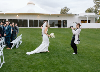 couple walking down aisle