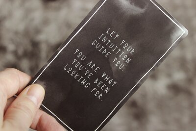A dark brown card says, “Let your intuition guide you. You are what you’ve been looking for.”