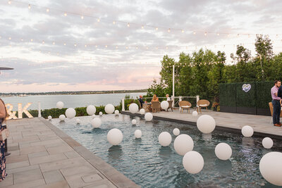 Floating Lights in inground pool for a chic engagement party