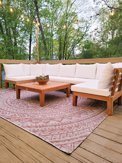 a sectional couch in an outdoor lounge area