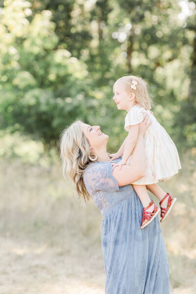 Mom holding daughter  for Portland family pictures