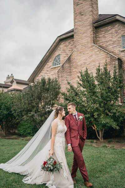 wedding couple coming out of the door from the Meridian House in Washington D.C.