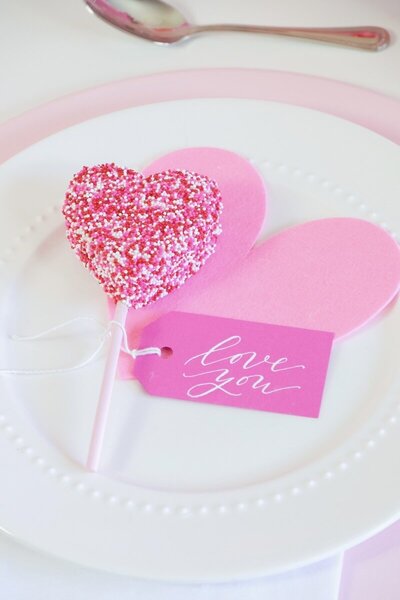 Pink gift tag with white ink calligraphy for Valentine's Day party favor