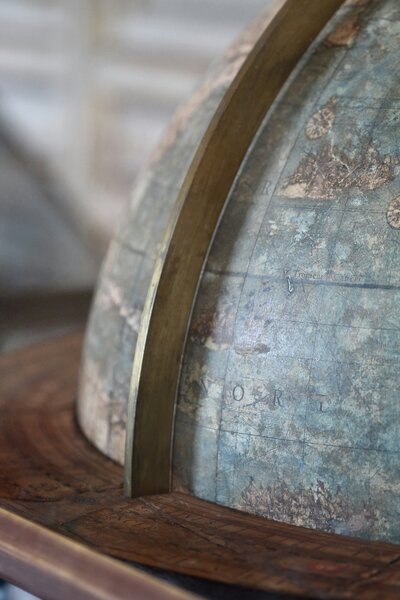 close up of a vintage globe - travel advisor
