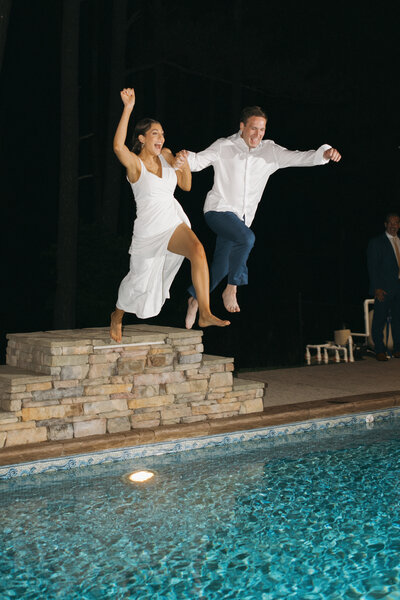 Birmingham documentary wedding photographer captures couple jumping into pool on their wedding day