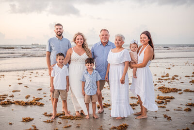 Children playing at the shoreline during family session in Central Florida