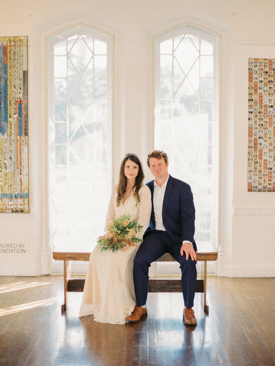 Bride and Groom sit together in Lexington Art League photographed by Lexington Kentucky luxury wedding photographer Magnolia Tree Photo Company