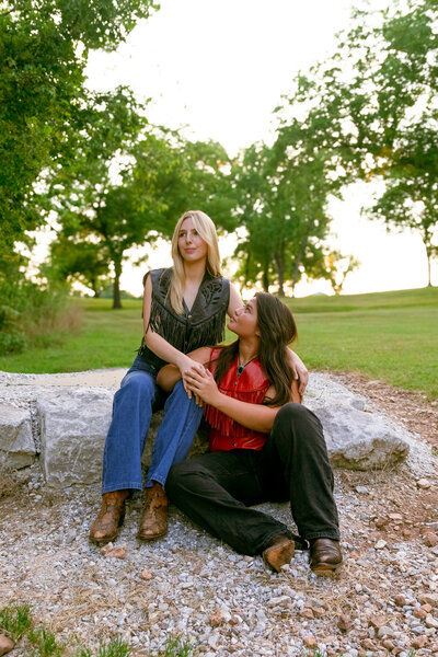 An indie LGBTQ+ couple’s moody editorial wedding portrait, photographed in a true-to-color style by Chelsea Stanford in Missouri.
