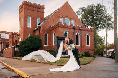 Bride and groom sharing a quiet moment outside of their urban venue during their downtown Chattanooga wedding.