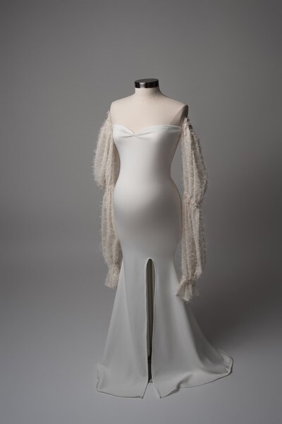 White long sleeve gown with soft train, ideal for editorial maternity looks