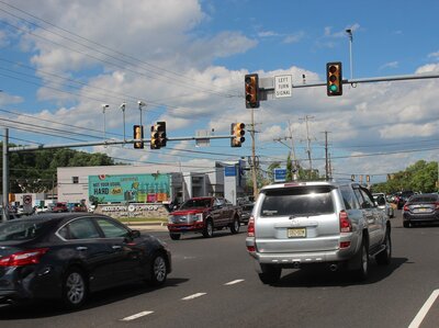 Lagunitas Billboard near an intersection with cars driving by