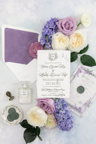 Letterpress wedding invitation suite on handmade paper with purple velvet envelope liner for a summer wedding in Montana