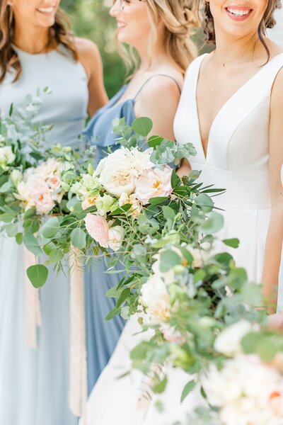 Light blue bridesmaid dresses and bouquets