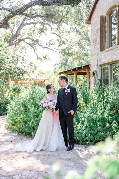 Korean couple look at each other at Hudson Bend Ranch in Austin, Texas.