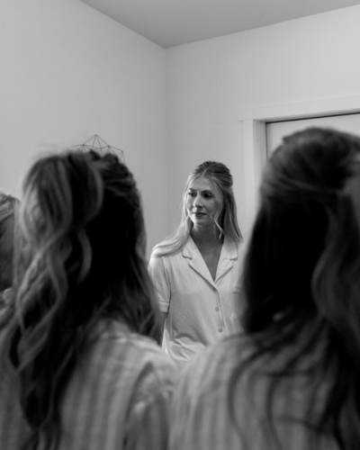 bride talking to her bridesmaids at her wedding