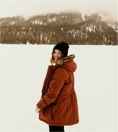 woman smiling in snow