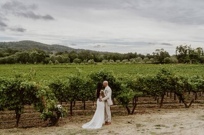 Newlyweds sharing a quiet moment after their private vineyard ceremony at B.R. Cohn in Sonoma, CA
