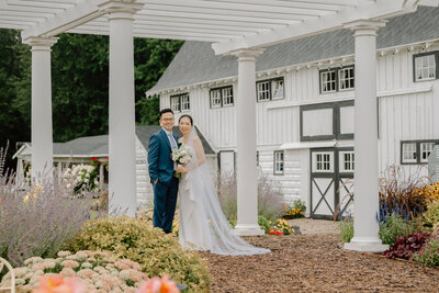 a bride and groom at Post Family Farm in the summer with a Grand Rapids wedding photographer