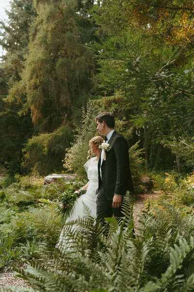 bride looking off into the distance at groom