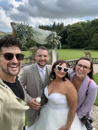 Amy & Nick posing with couple