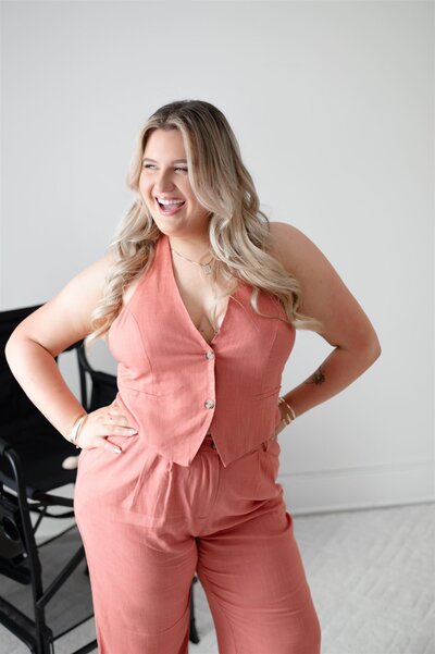 Chelsea, a makeup artist in Boston Massachusetts, laughs while posing for photos. 