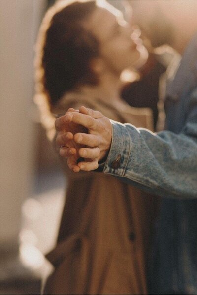 Couple holding hands